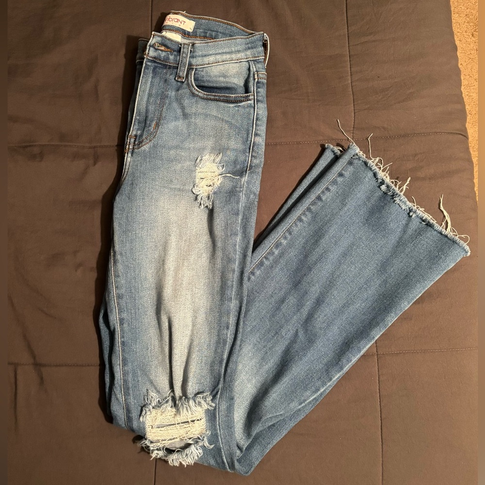 Vibrant, light denim, distressed bootcut jeans